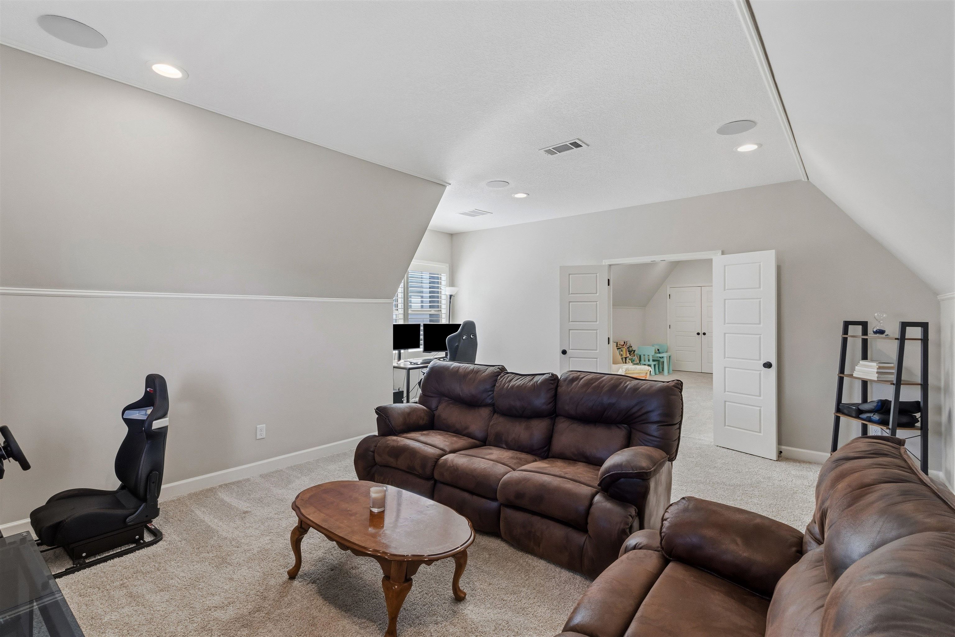 4757 Carousel Lane Collierville, TN 38017 - Photo 29 of 39 Carpeted Media room featuring vaulted ceiling and recessed lighting