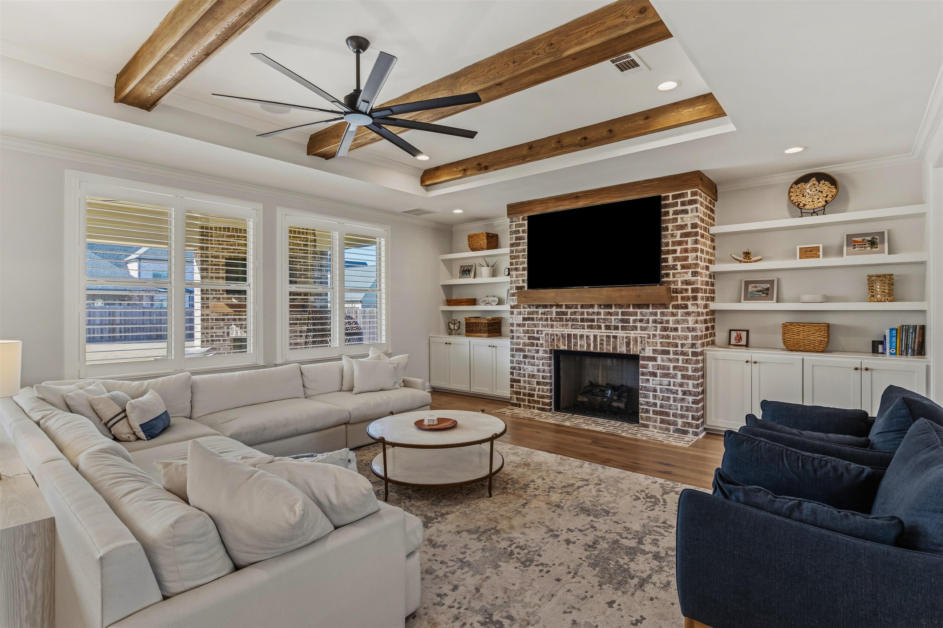 4757 Carousel Lane Collierville, TN 38017 - Photo 8 of 39 Living room with ornamental molding, wood finished floors, ceiling fan, a brick fireplace, and recessed lighting