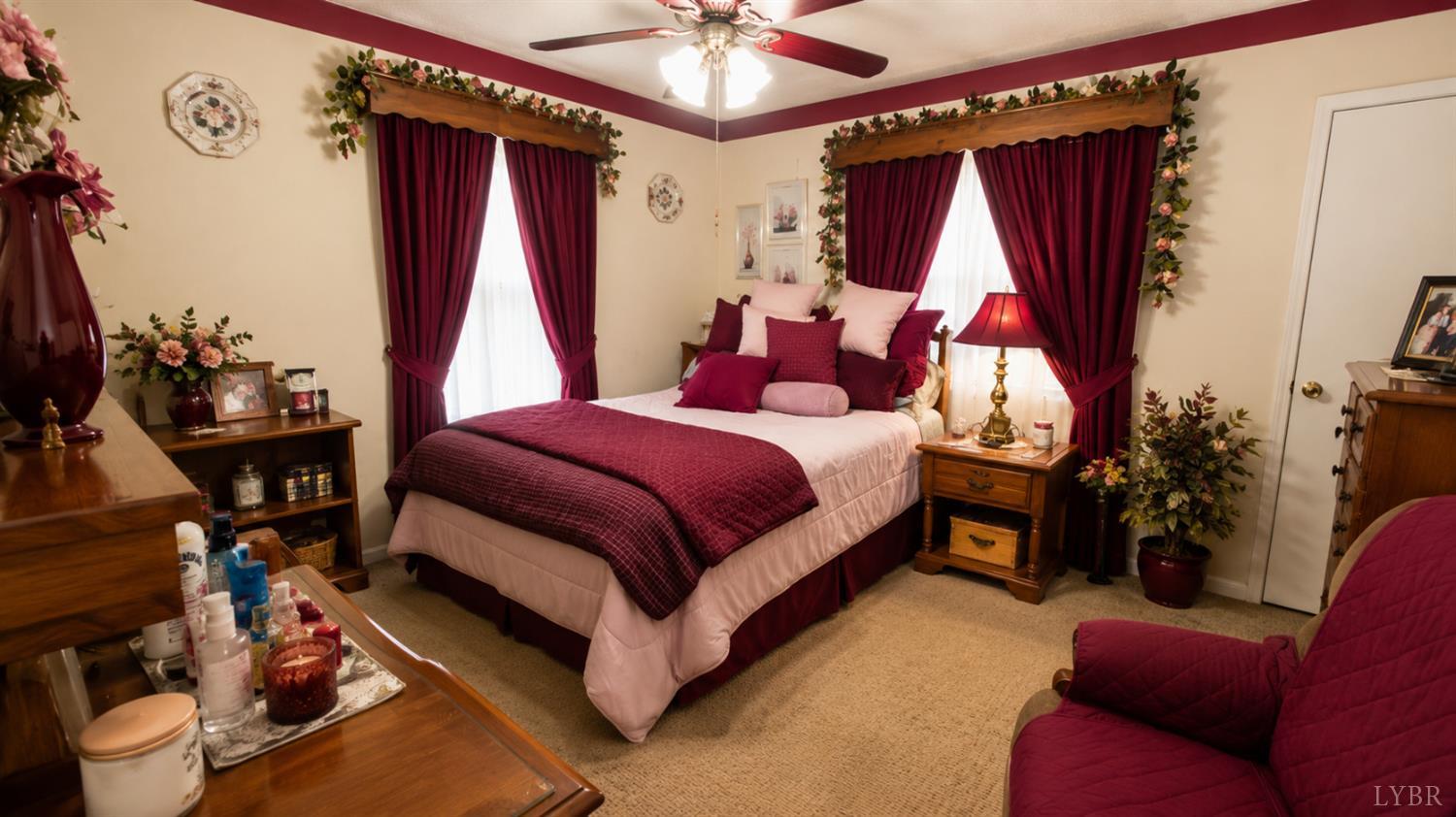 2346 Mitchell Mill Road Gladys, VA 24554 - Photo 8 of 38 a bedroom with a bed and a chandelier