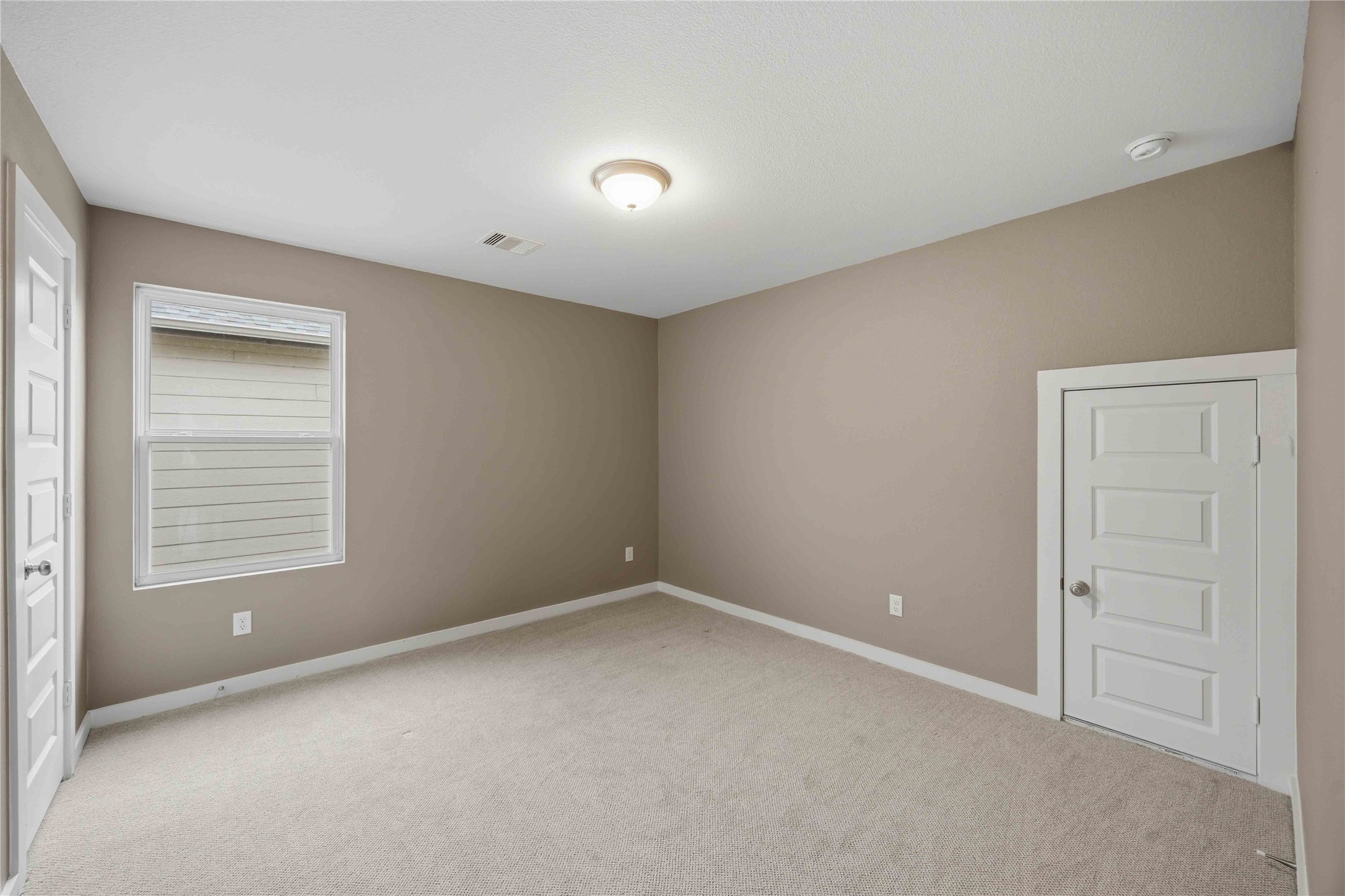 1239 Cascade Hls Drive Rosharon, TX 77583 - Photo 23 of 30 a view of an empty room with a window