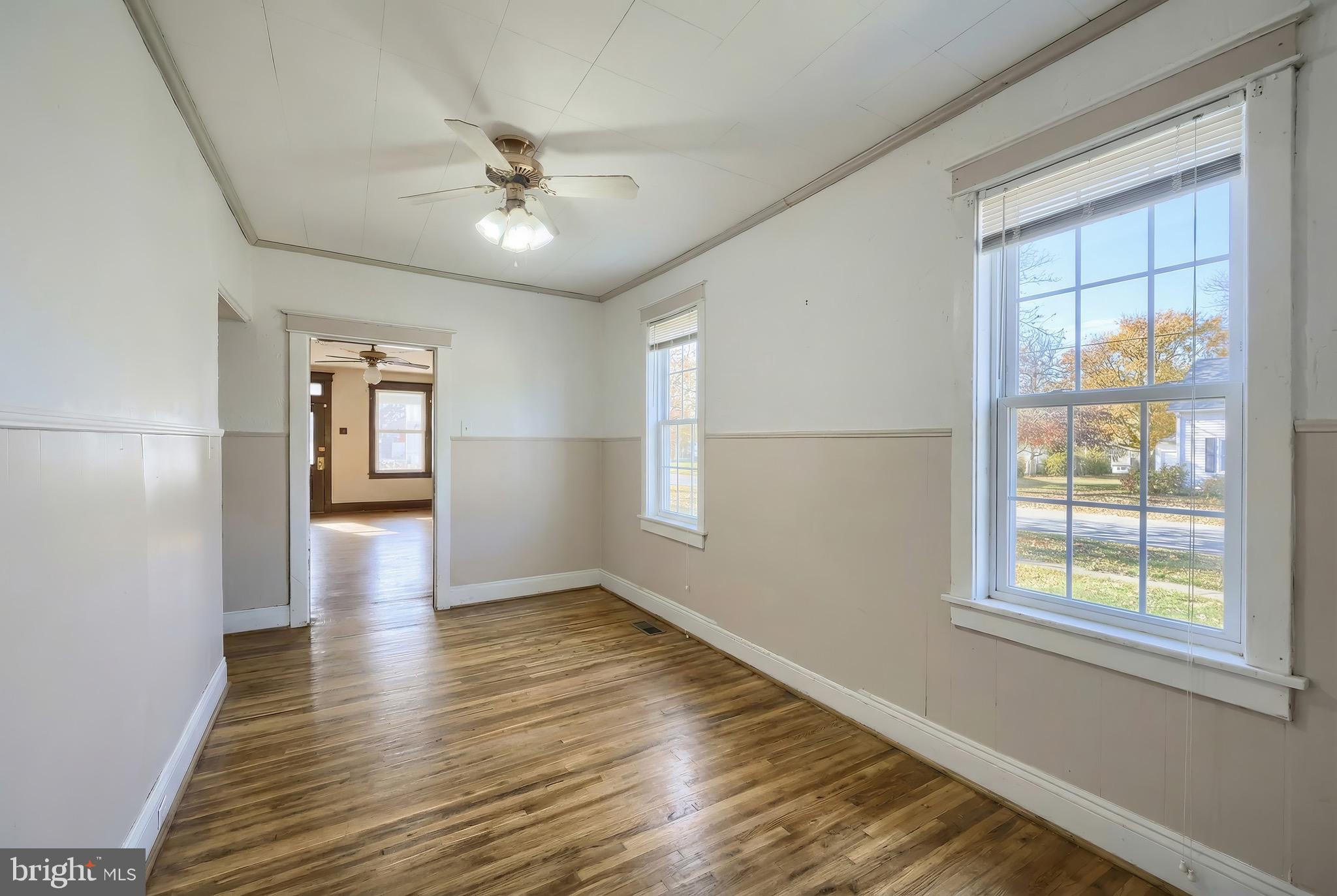 52 South Third Street Mount Wolf, PA 17347 - Photo 15 of 28 wooden floor in an empty room with a window