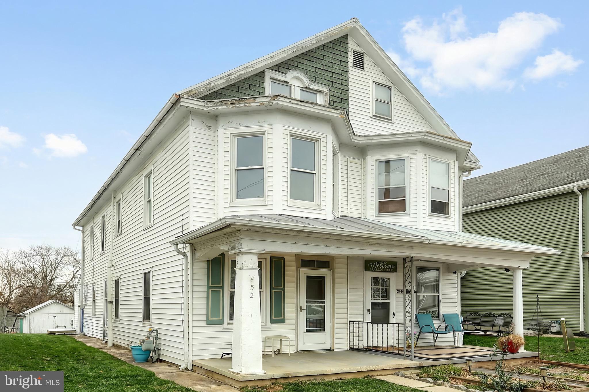 52 South Third Street Mount Wolf, PA 17347 - Photo 3 of 28 a front view of a house with a yard