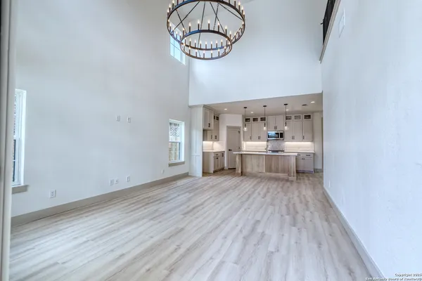 a view of a room with wooden floor
