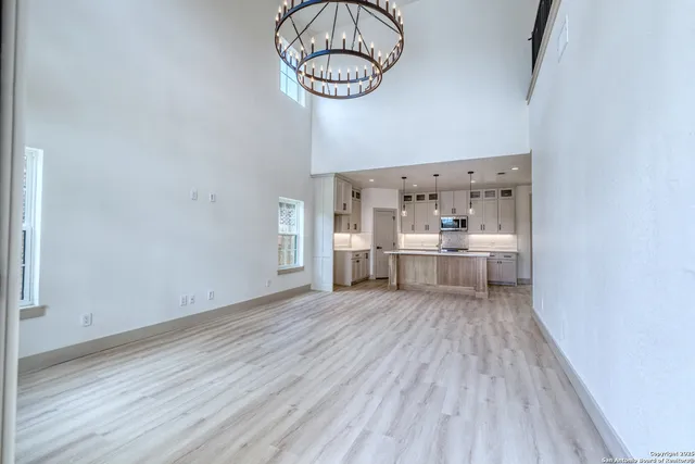 a view of a room with wooden floor