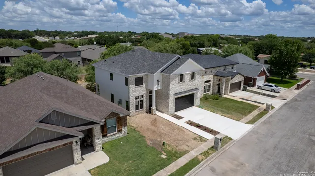a aerial view of a house with a yard