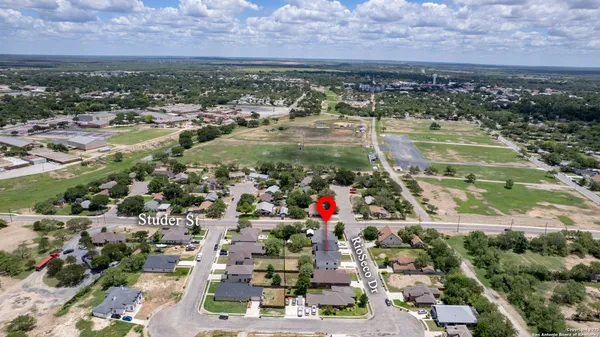 an aerial view of houses with outdoor space
