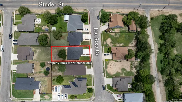 an aerial view of house with yard