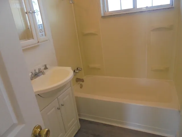 a bathroom with sink shower and bathtub