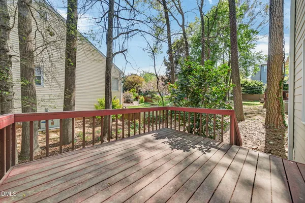 a view of a balcony with wooden floor