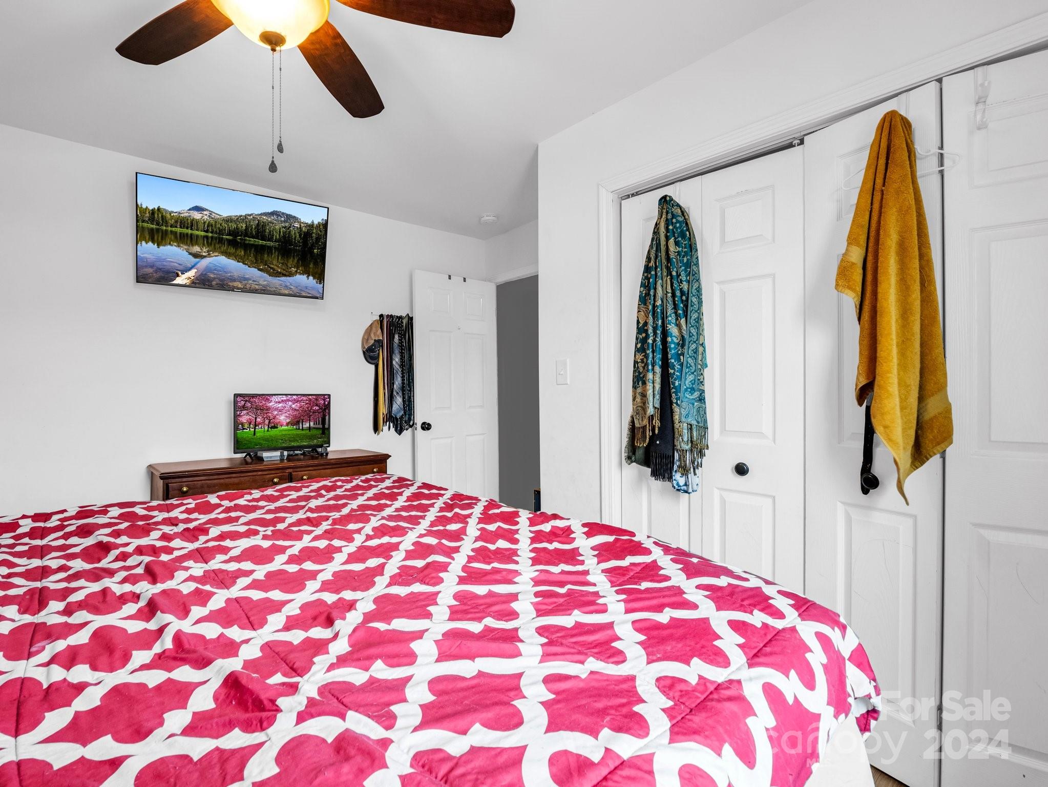 1251 Howards Creek Mill Road Vale, NC 28168 - Photo 13 of 30 a bedroom with a bed and a lamp