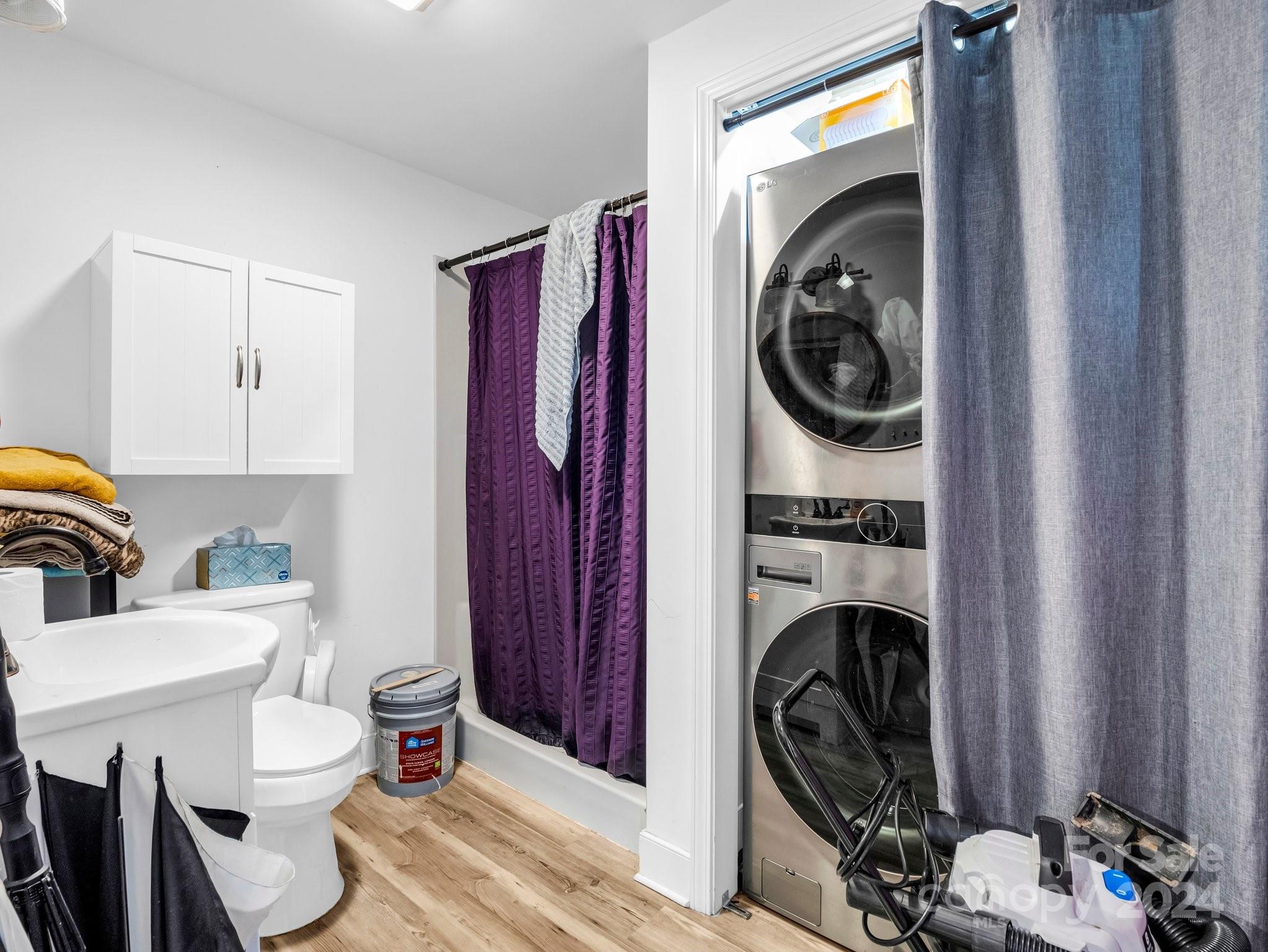 1251 Howards Creek Mill Road Vale, NC 28168 - Photo 21 of 30 a view of a bedroom with washer and dryer
