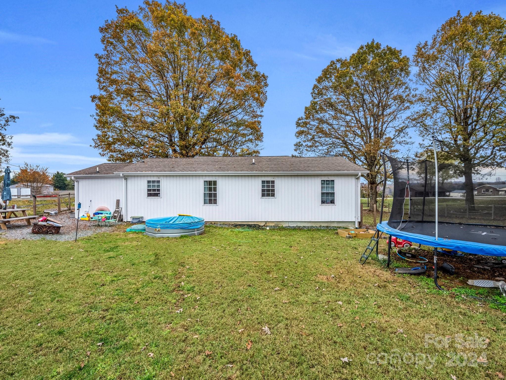 1251 Howards Creek Mill Road Vale, NC 28168 - Photo 23 of 30 a view of a house with backyard and a tree