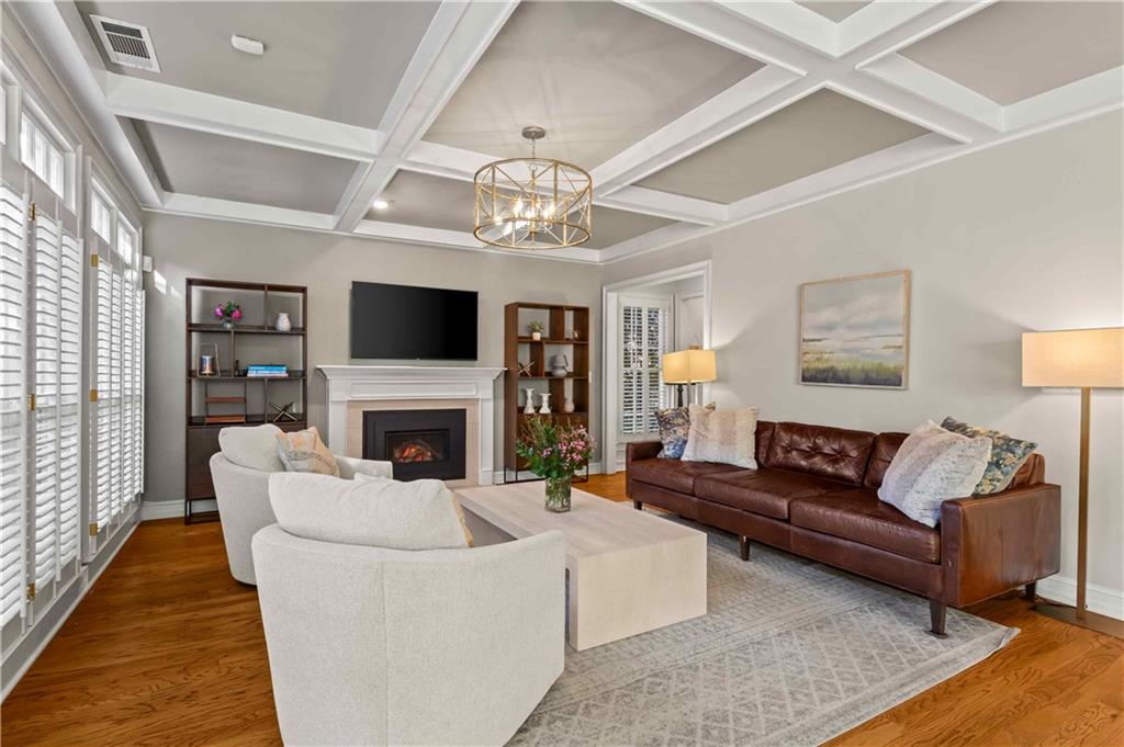 4120 Paran Pointe Drive Northwest Atlanta, GA 30327 - Photo 11 of 47 a living room with furniture a fireplace and a flat screen tv
