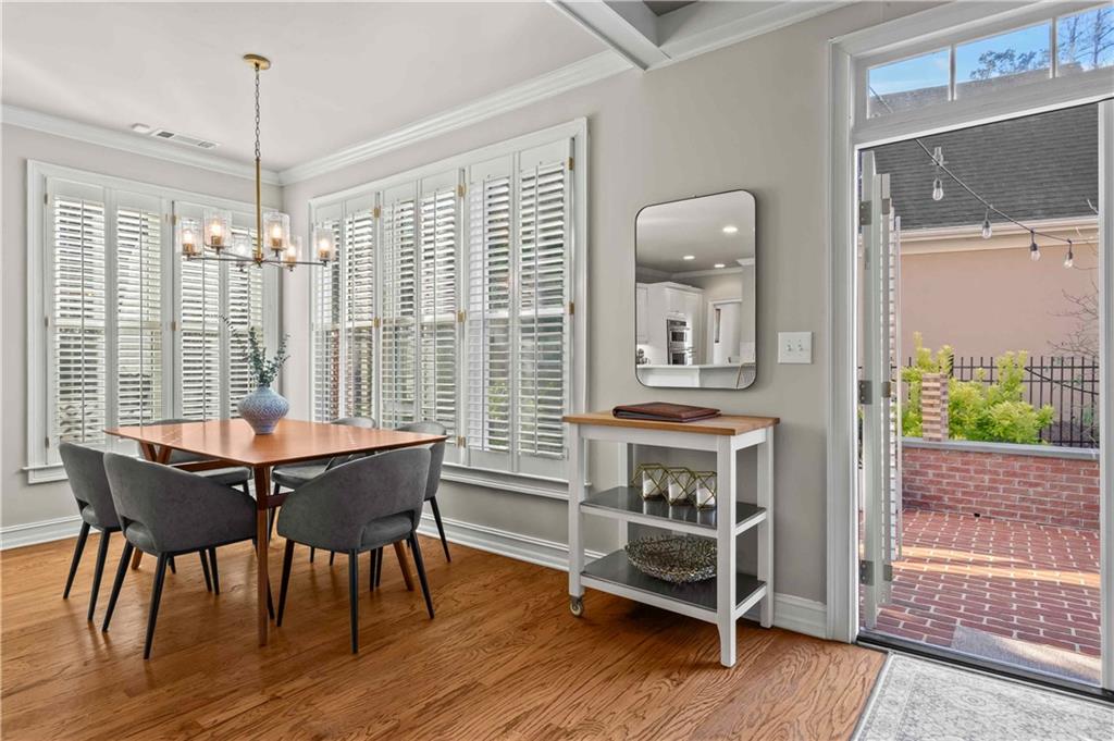 4120 Paran Pointe Drive Northwest Atlanta, GA 30327 - Photo 16 of 47 a dining room with furniture large windows and a chandelier
