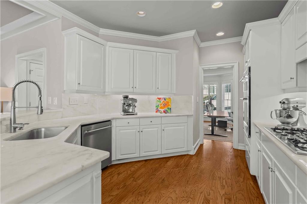 4120 Paran Pointe Drive Northwest Atlanta, GA 30327 - Photo 19 of 47 a kitchen with stainless steel appliances granite countertop a stove a sink dishwasher and a refrigerator