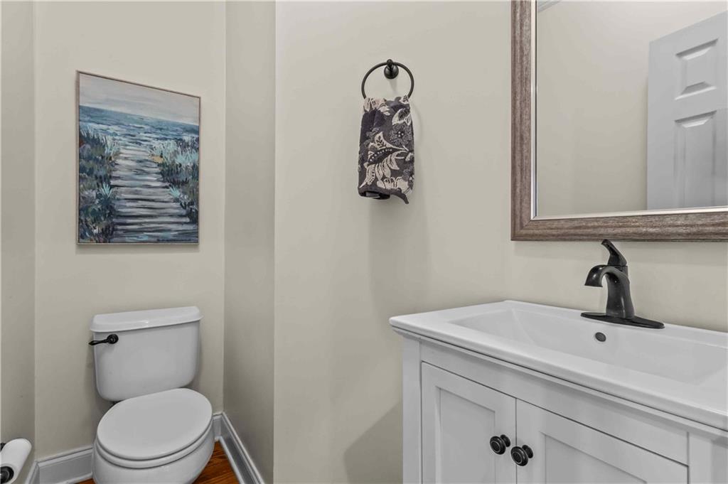 4120 Paran Pointe Drive Northwest Atlanta, GA 30327 - Photo 26 of 47 a bathroom with a toilet sink and mirror