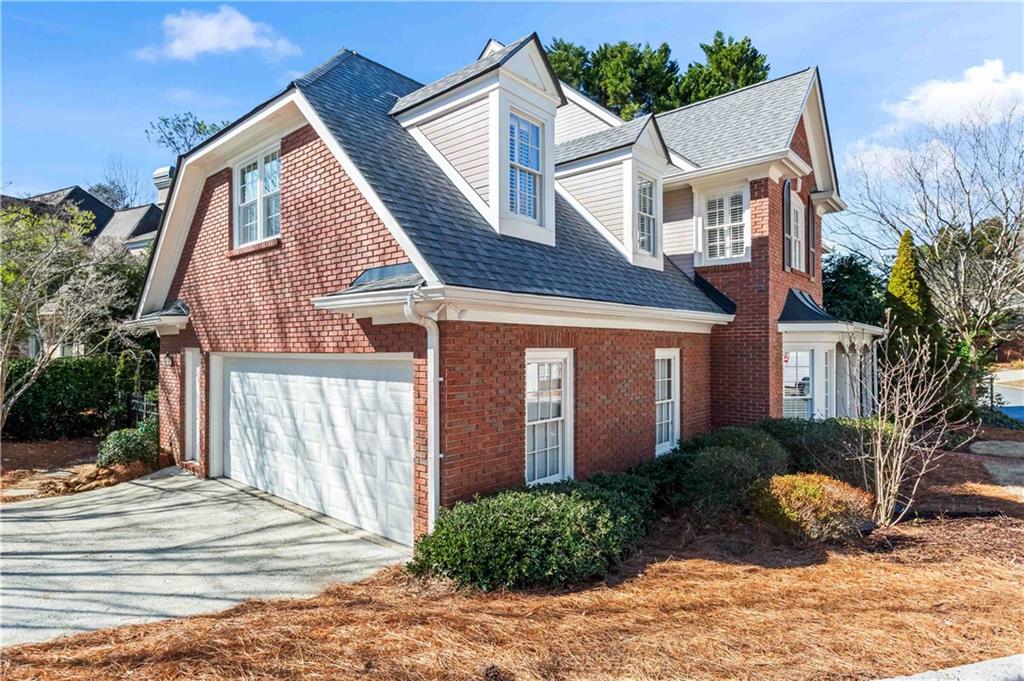 4120 Paran Pointe Drive Northwest Atlanta, GA 30327 - Photo 3 of 47 a front view of a house with a yard