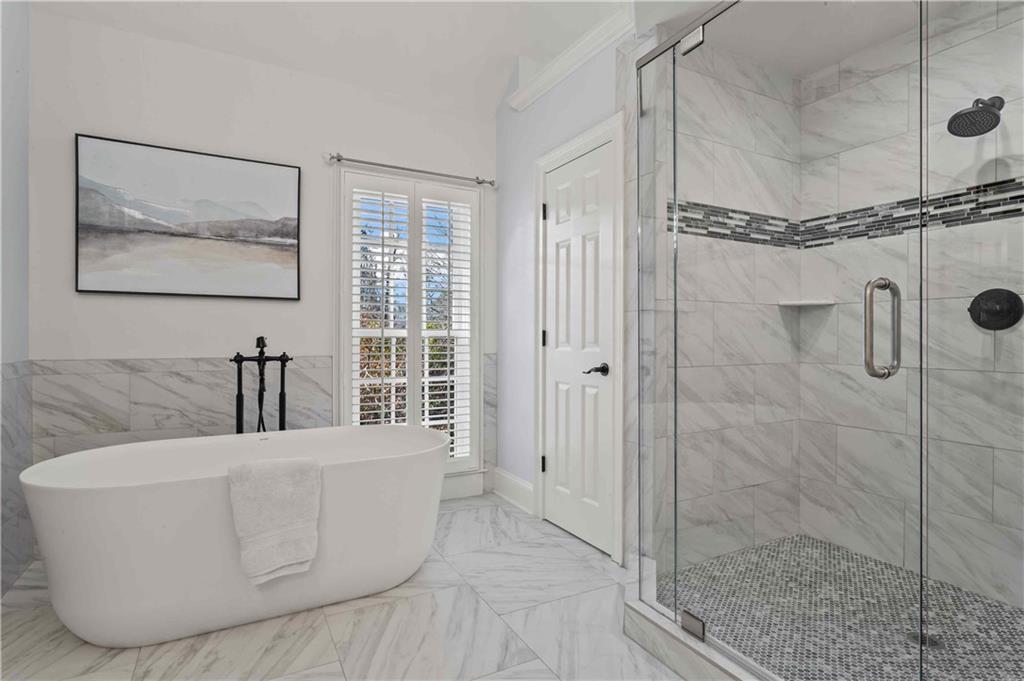4120 Paran Pointe Drive Northwest Atlanta, GA 30327 - Photo 32 of 47 a bathroom with a bathtub and shower