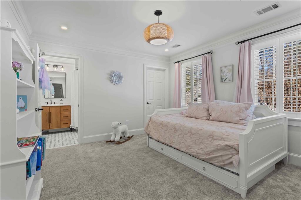 4120 Paran Pointe Drive Northwest Atlanta, GA 30327 - Photo 36 of 47 a bedroom with a bed and a chandelier
