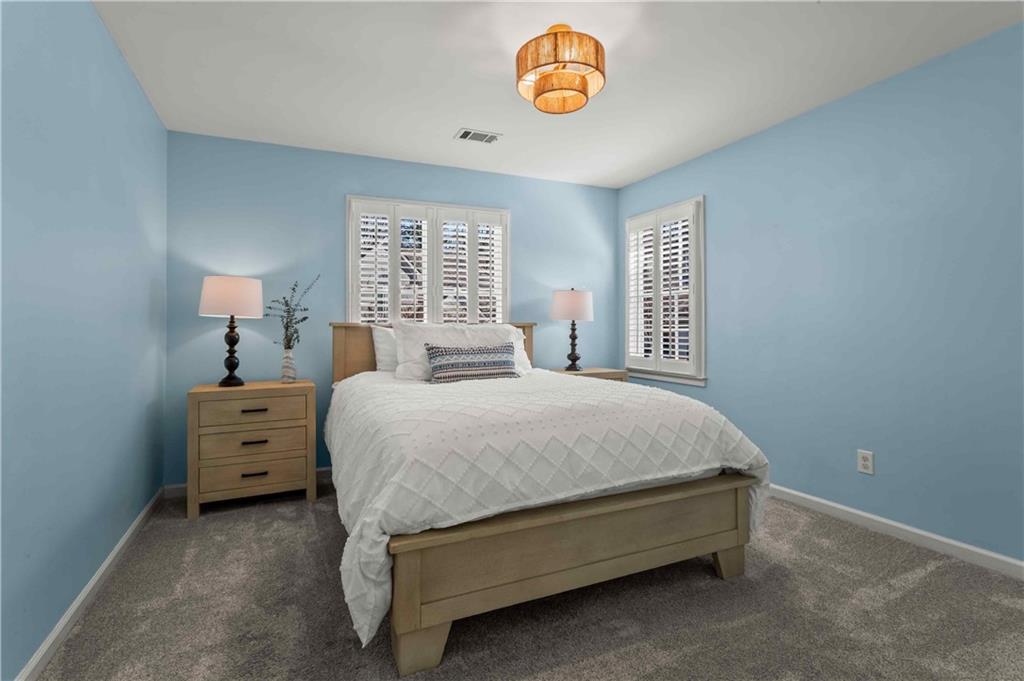 4120 Paran Pointe Drive Northwest Atlanta, GA 30327 - Photo 38 of 47 a spacious bedroom with a bed and a window