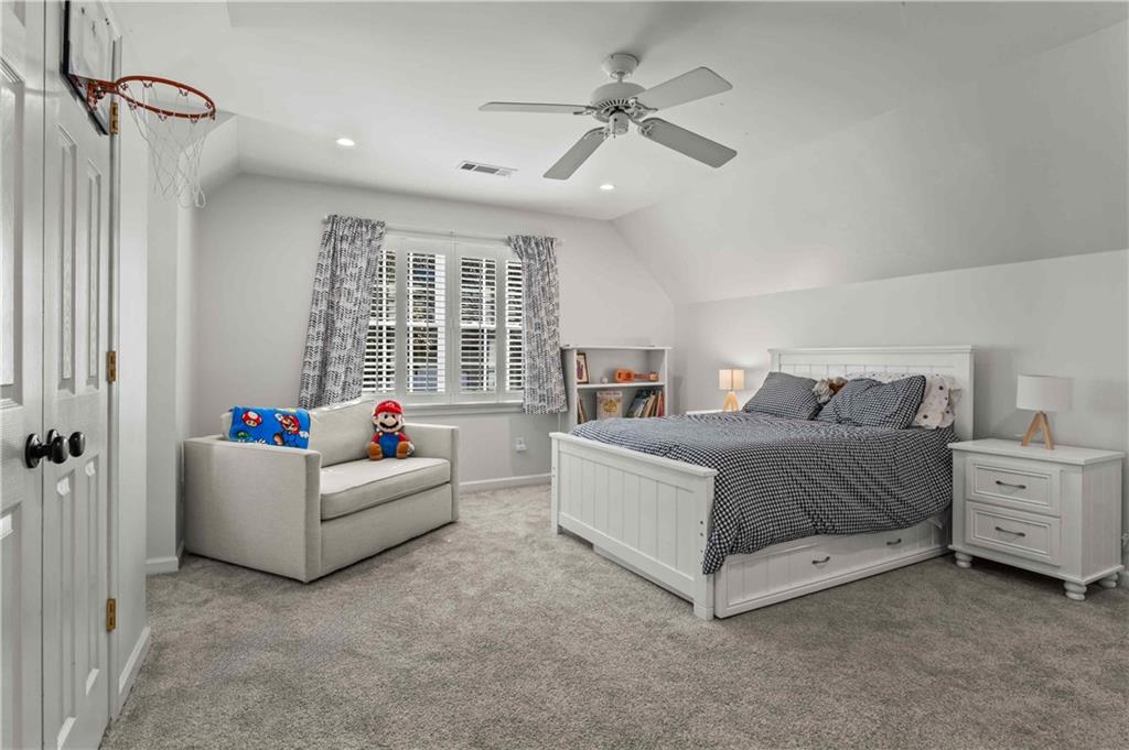 4120 Paran Pointe Drive Northwest Atlanta, GA 30327 - Photo 39 of 47 a bedroom with a bed and a chandelier