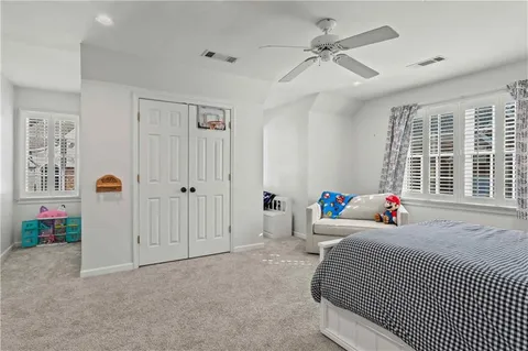 a living room with furniture and windows