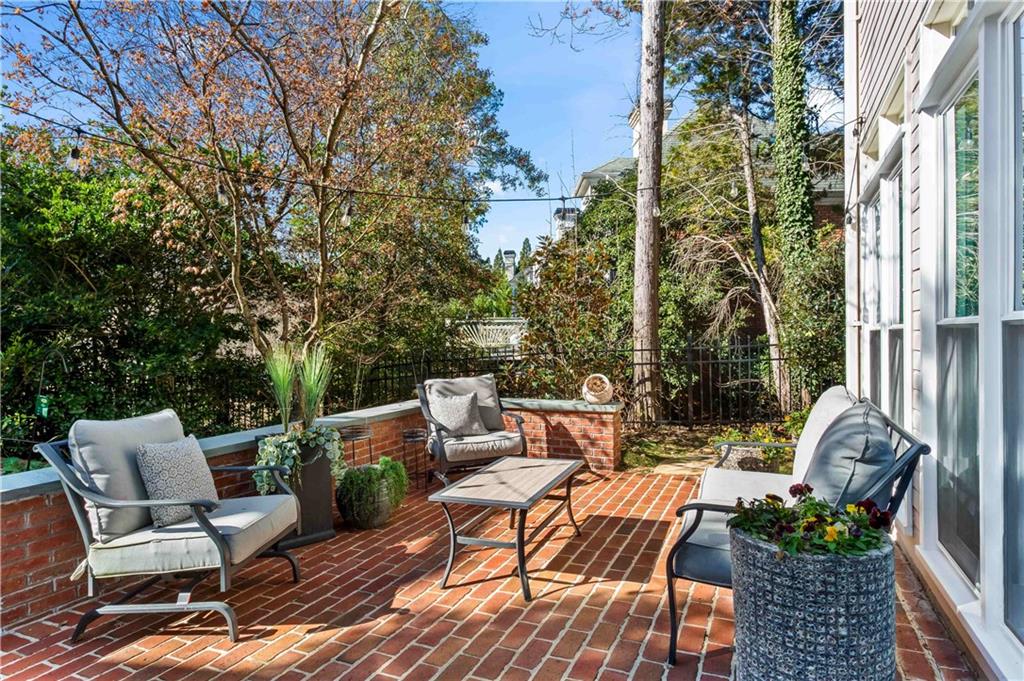 4120 Paran Pointe Drive Northwest Atlanta, GA 30327 - Photo 42 of 47 a view of a patio with couches table and chairs and potted plants