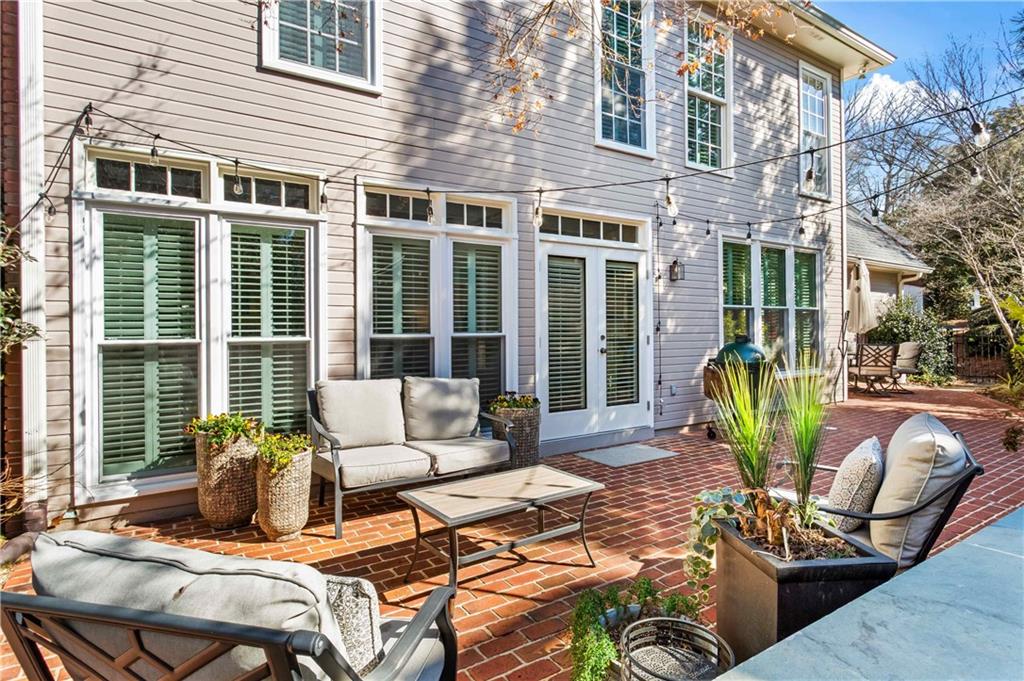 4120 Paran Pointe Drive Northwest Atlanta, GA 30327 - Photo 43 of 47 a view of a patio with couches chairs and potted plants