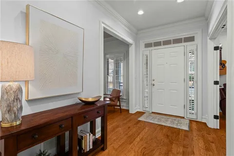 a view of room with furniture and wooden floor