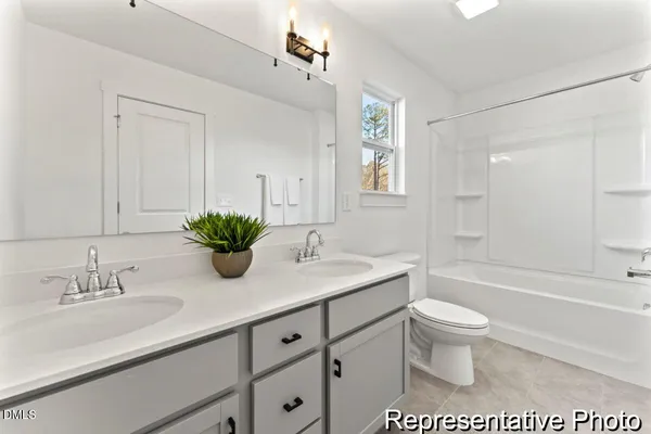 a bathroom with a sink a toilet and a bathtub