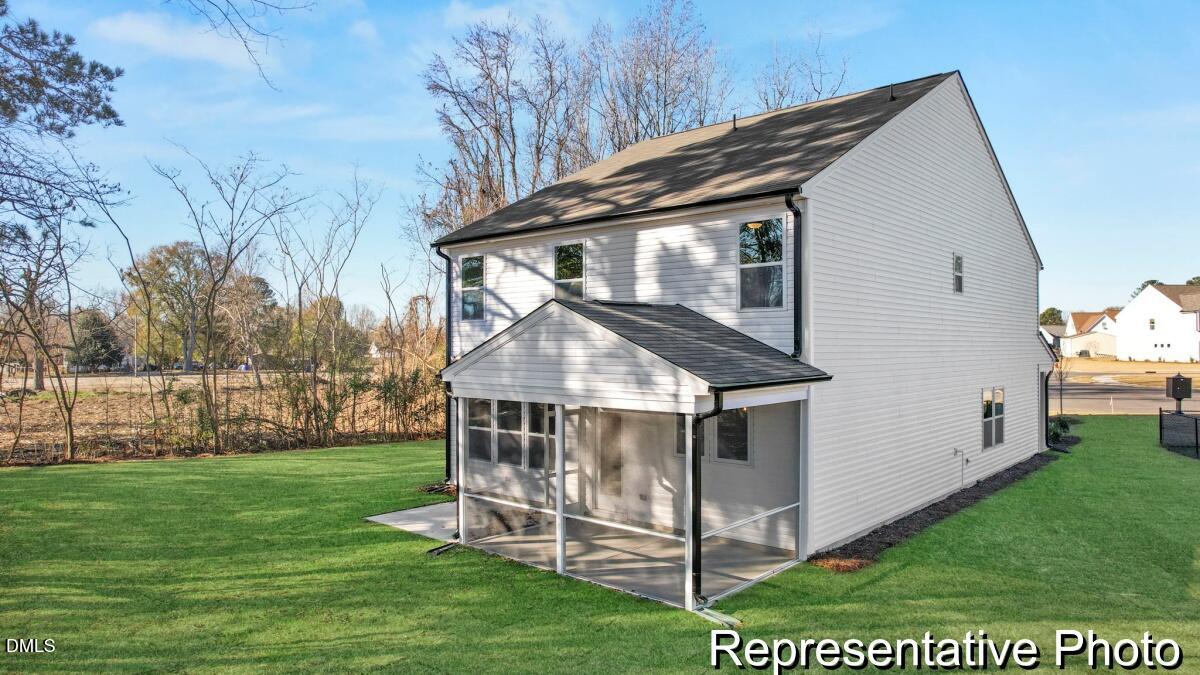105 Cedarbranch Way, Unit 183P Dunn, NC 28334 - Photo 3 of 24 a house with garden in front of it
