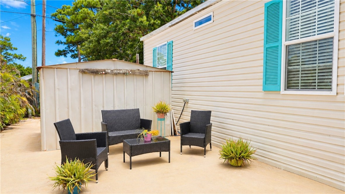 324 Valencia Street Sebastian, FL 32958 - Photo 21 of 21 a roof deck with table and chairs under an umbrella