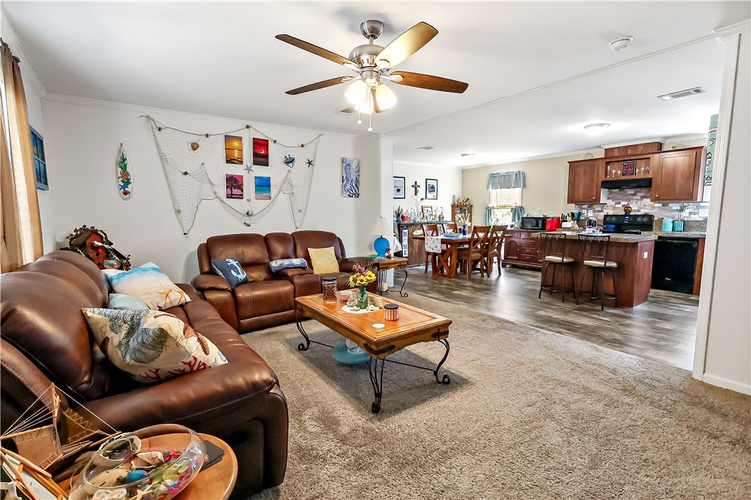 324 Valencia Street Sebastian, FL 32958 - Photo 4 of 21 a living room with furniture and a large window