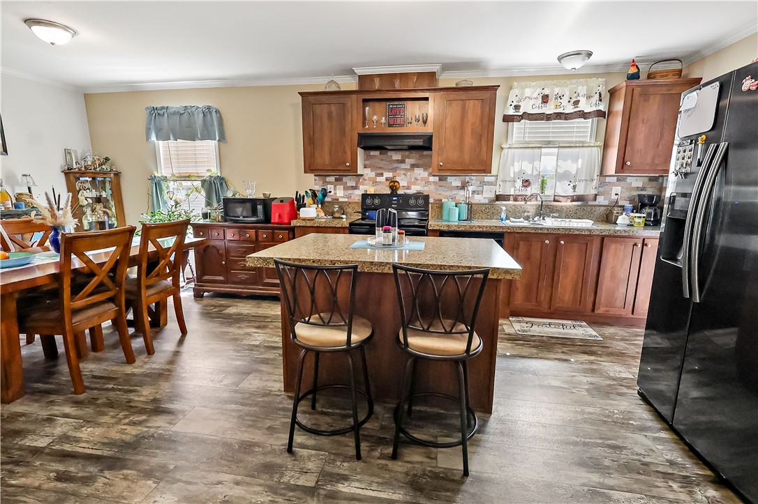 324 Valencia Street Sebastian, FL 32958 - Photo 8 of 21 a dining hall with stainless steel appliances granite countertop a dining table and chairs