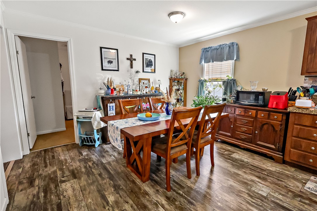324 Valencia Street Sebastian, FL 32958 - Photo 10 of 21 a dining room with furniture and wooden floor