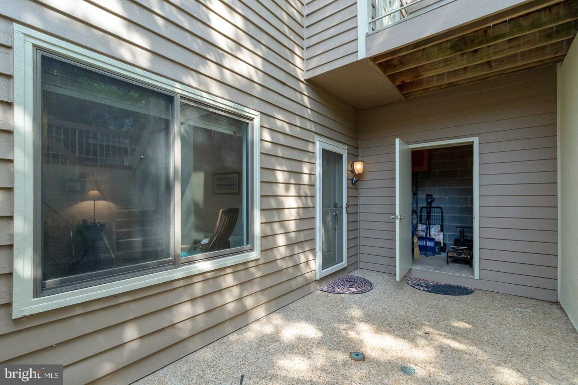 11184 Harbor Court Reston, VA 20191 - Photo 25 of 32 Shaded aggregate patio with large secure storage