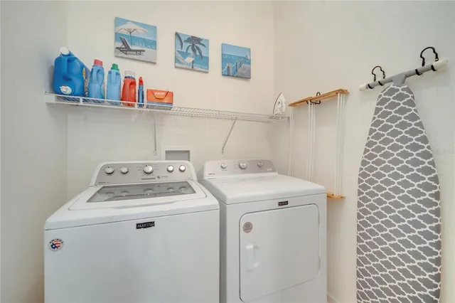 a dining room filled with furniture and flowers