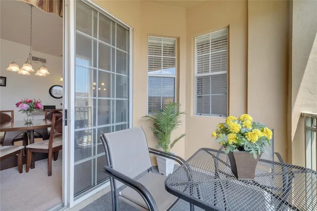 a view of balcony with furniture