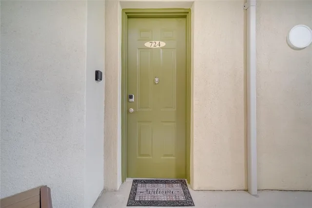 a living room with furniture and a book shelf