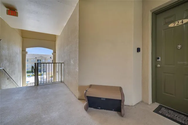 a room with furniture pool table and wooden floor