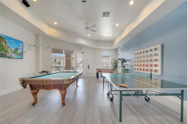 a living room with a couch and a chandelier