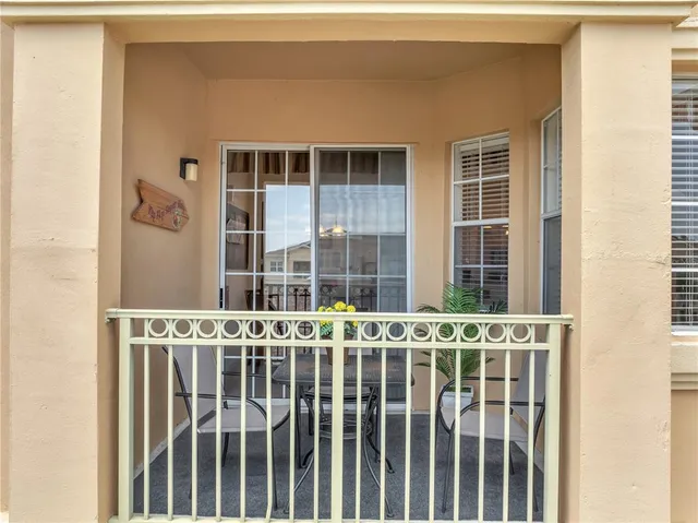 a front view of a residential apartment building with a yard