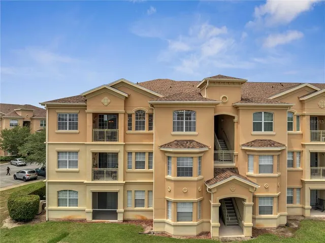 a view of swimming pool and outdoor seating