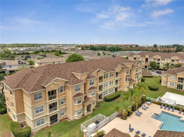 an aerial view of a house with outdoor space