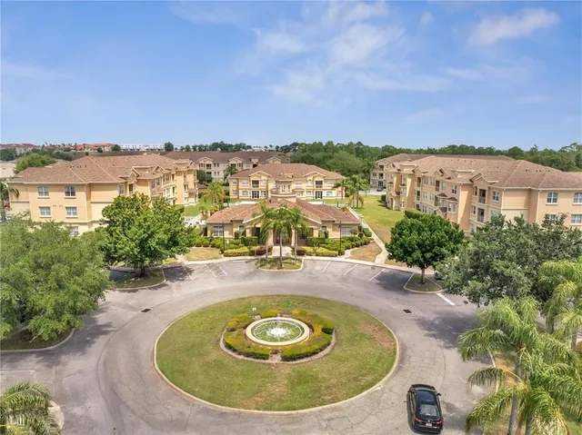 a front view of a building with a yard