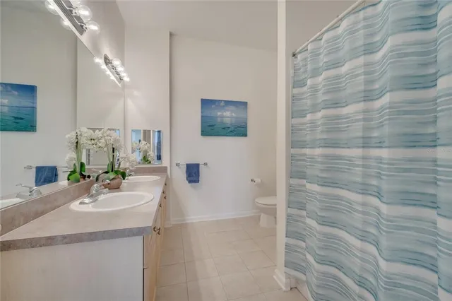 a bathroom with a sink a mirror and a shower