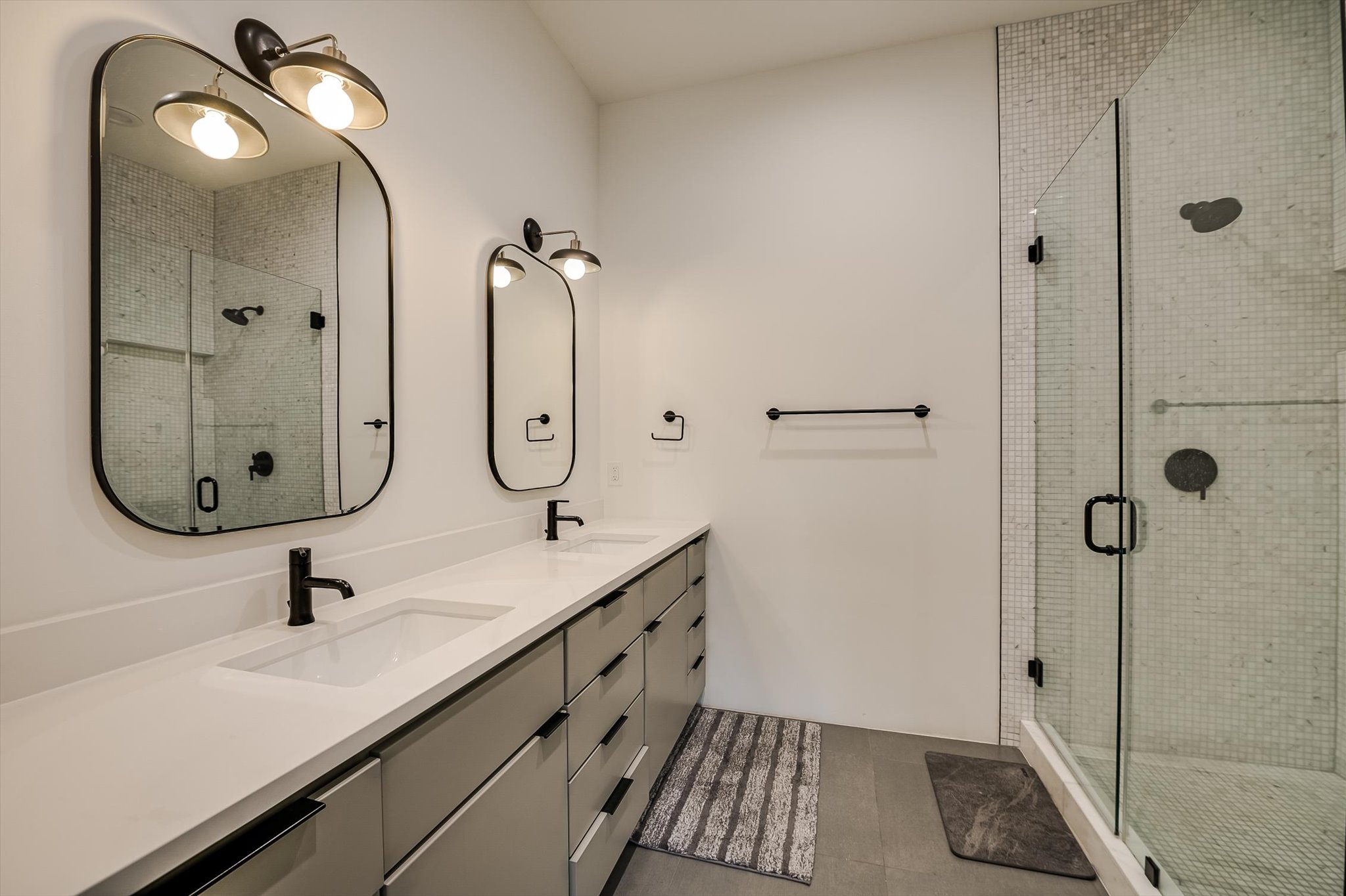 410 West Alpine Road, Unit 4 Austin, TX 78704 - Photo 12 of 24 a bathroom with a granite countertop sink a toilet and shower