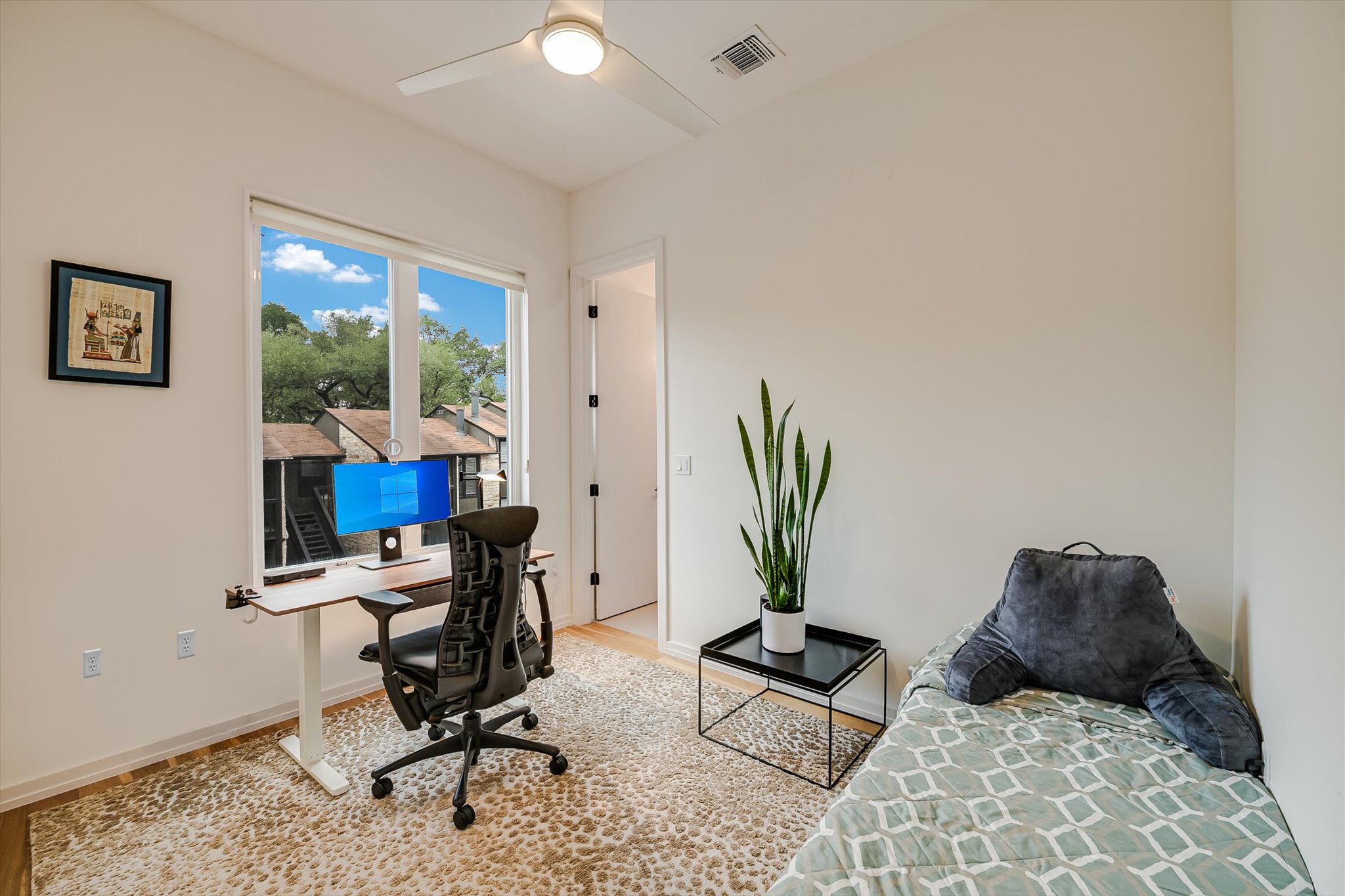 410 West Alpine Road, Unit 4 Austin, TX 78704 - Photo 14 of 24 a view of a workspace with furniture and a potted plant