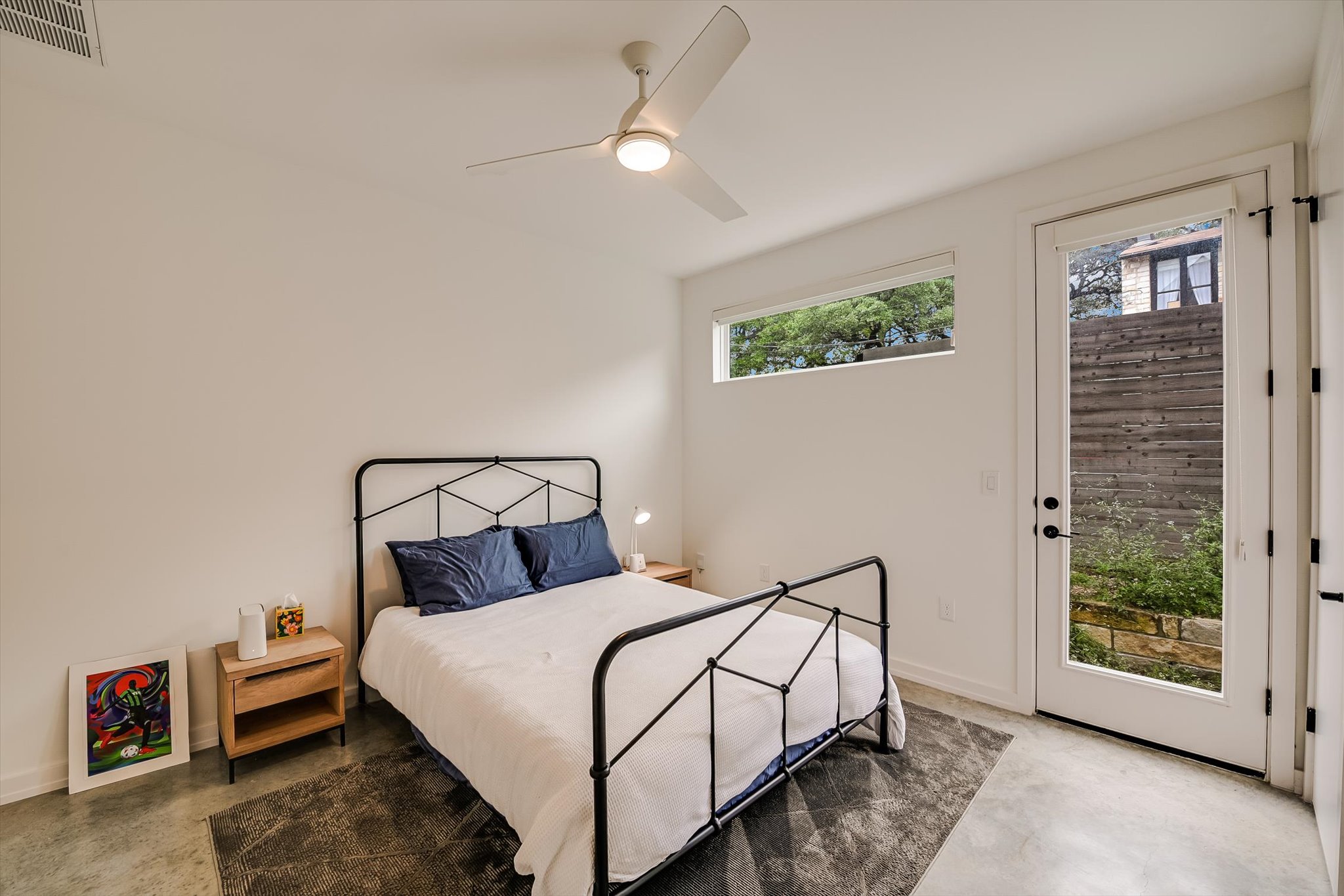410 West Alpine Road, Unit 4 Austin, TX 78704 - Photo 16 of 24 a bedroom with a bed and a window