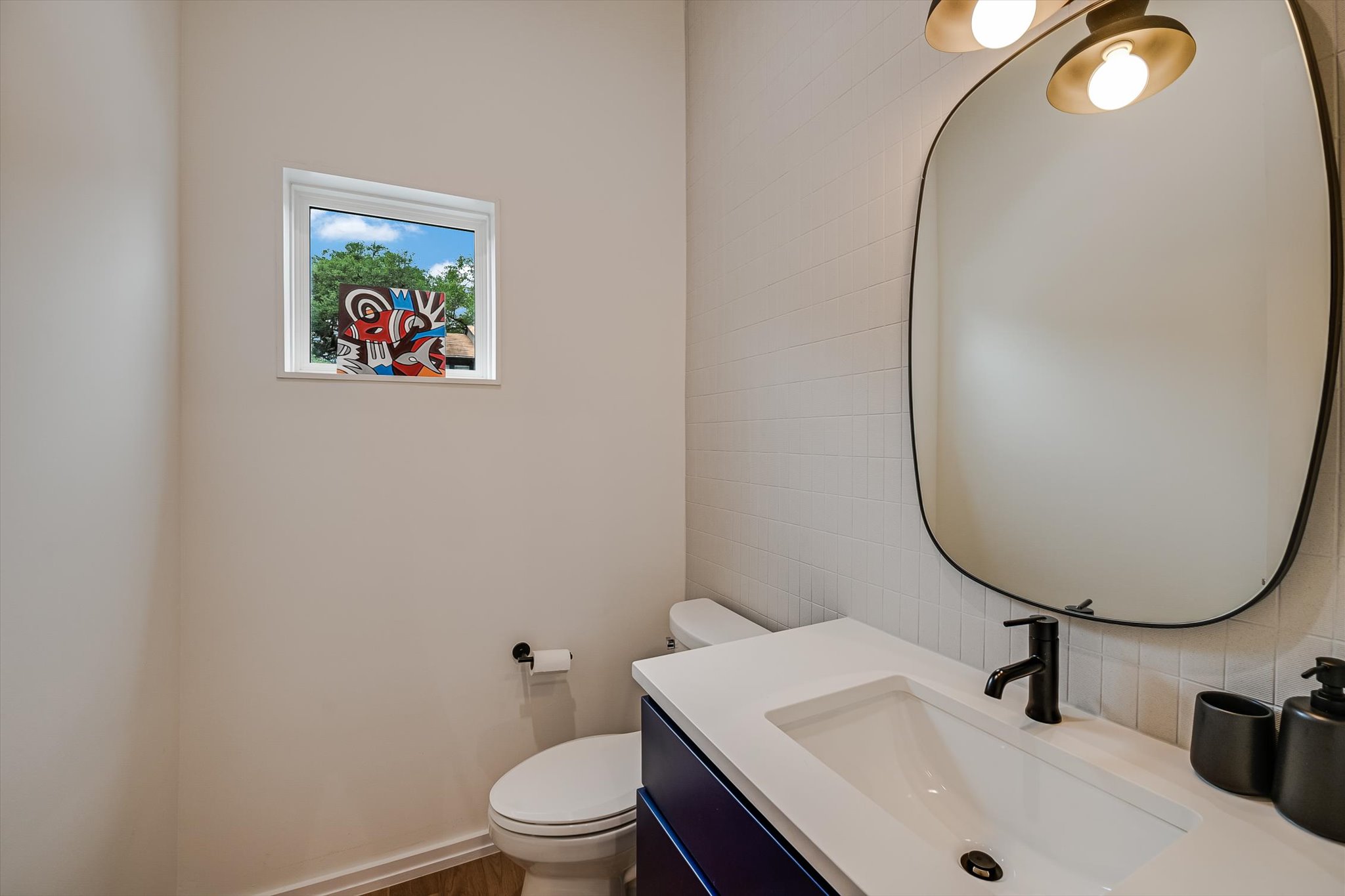 410 West Alpine Road, Unit 4 Austin, TX 78704 - Photo 18 of 24 a bathroom with a sink mirror and toilet